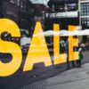 Yellow sale sign in a shop window