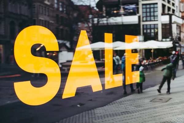 Yellow sale sign in a shop window